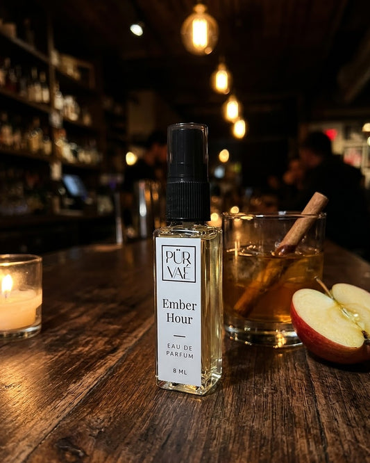 Ember Hour on a walnut bar counter at night with apple and cinnamon