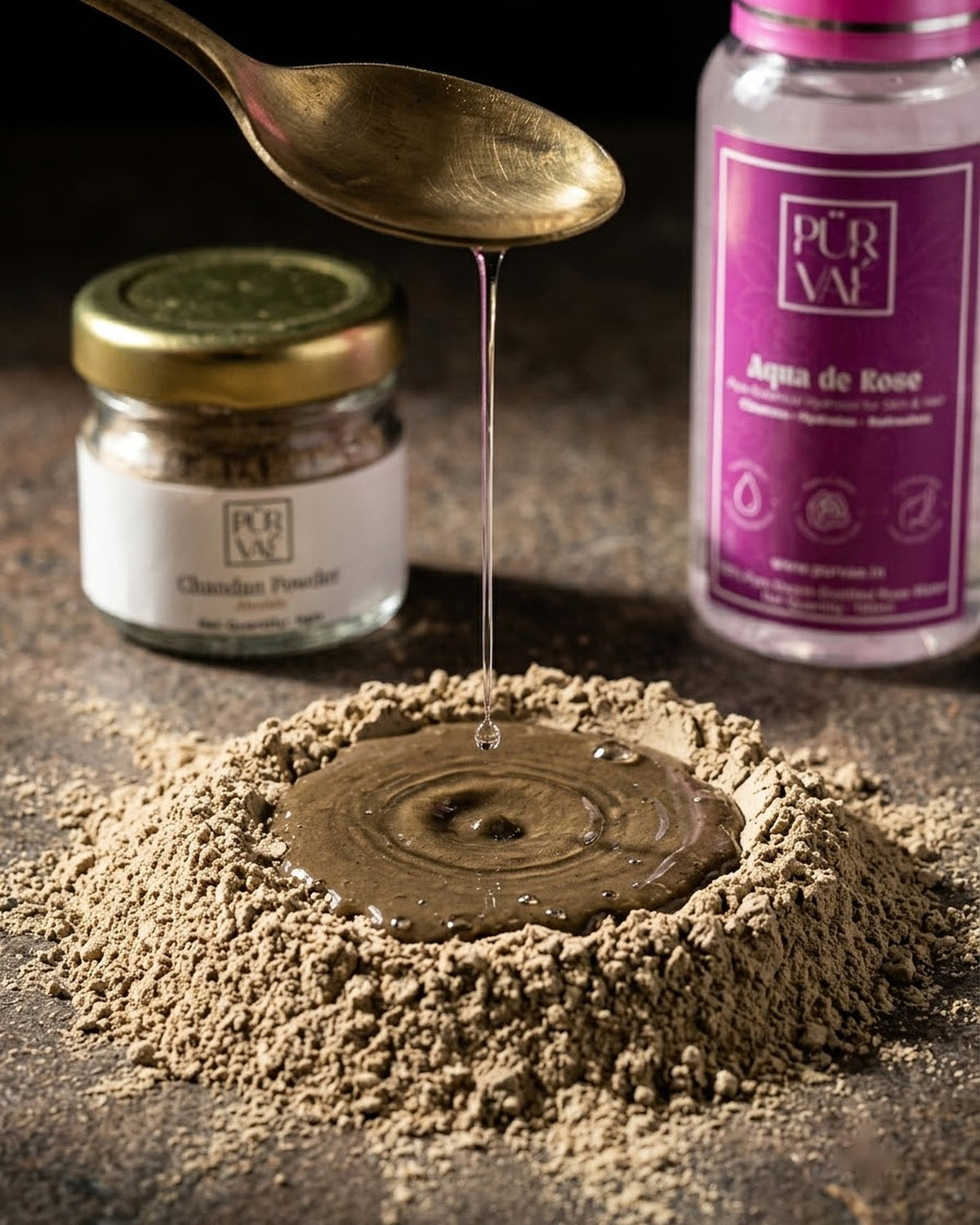 Rose water falling onto chandan powder