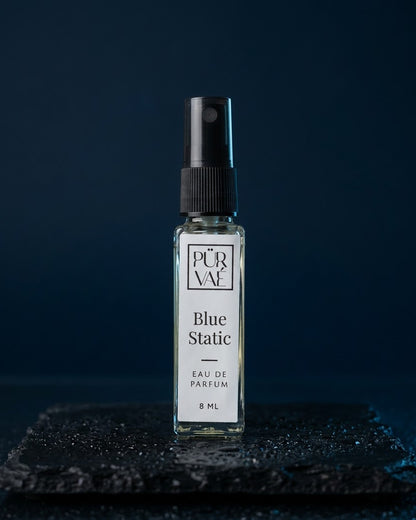 Blue Static eau de parfum 8 ml glass spray on wet slate in midnight blue light