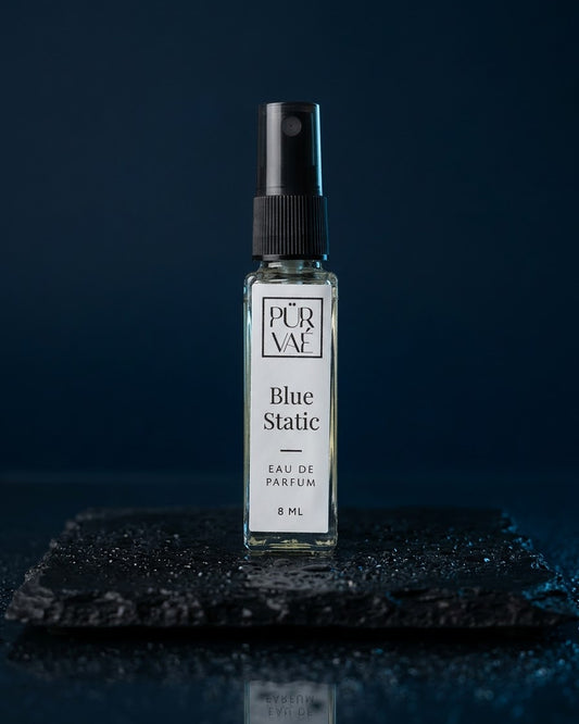 Blue Static eau de parfum 8 ml glass spray on wet slate in midnight blue light