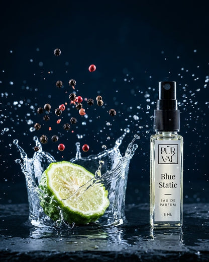 Bergamot and peppercorns splashing into water beside Blue Static