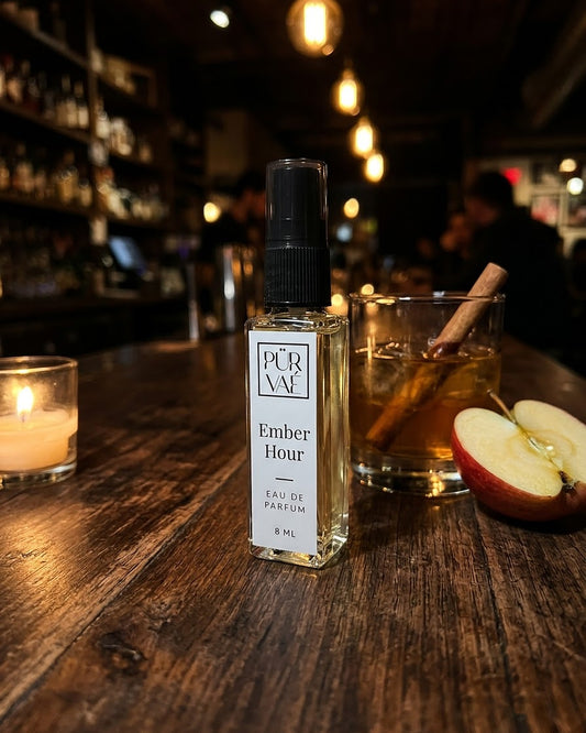 Ember Hour on a walnut bar counter at night with apple and cinnamon