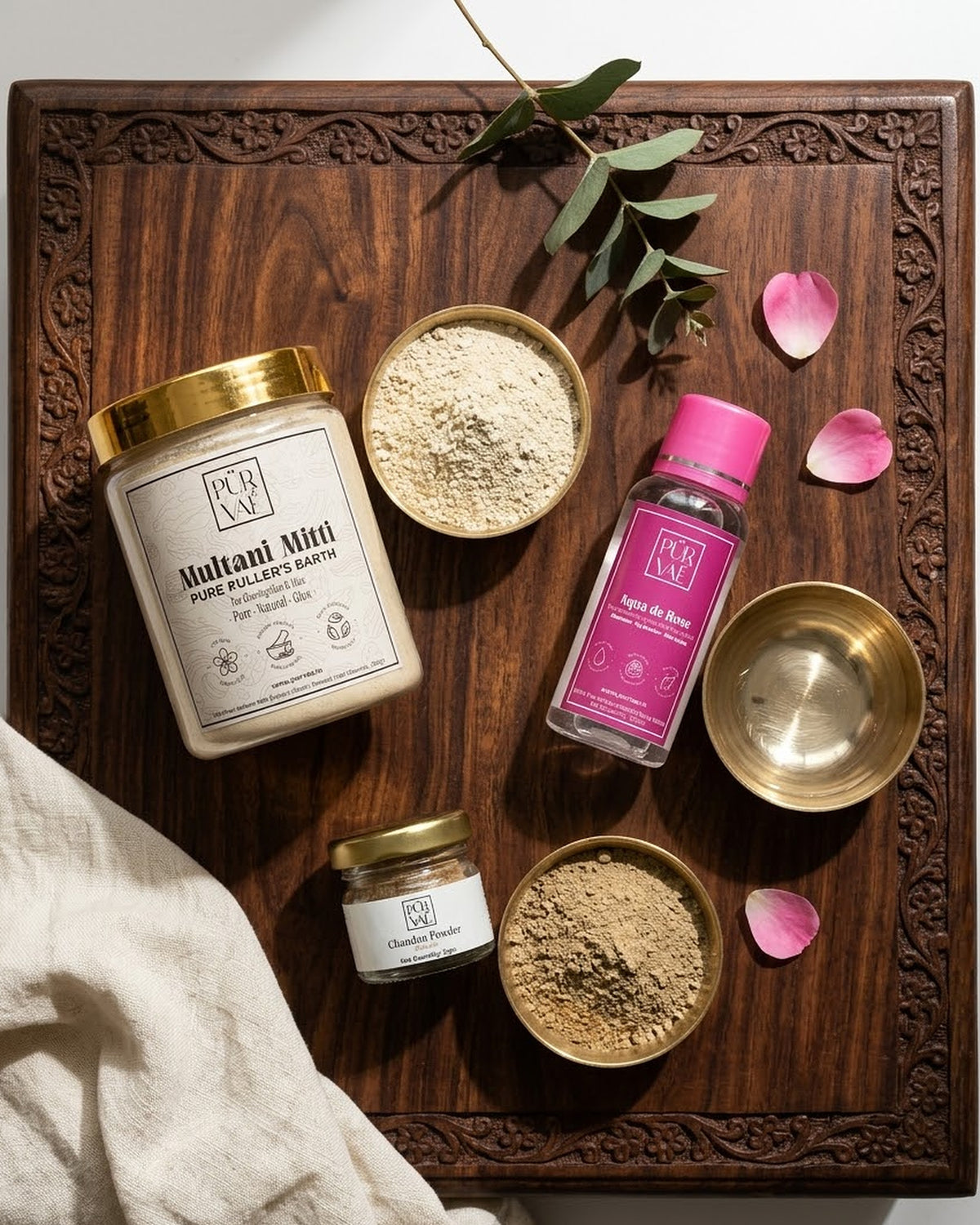 Face Pack Trio styled on a wooden ritual tray