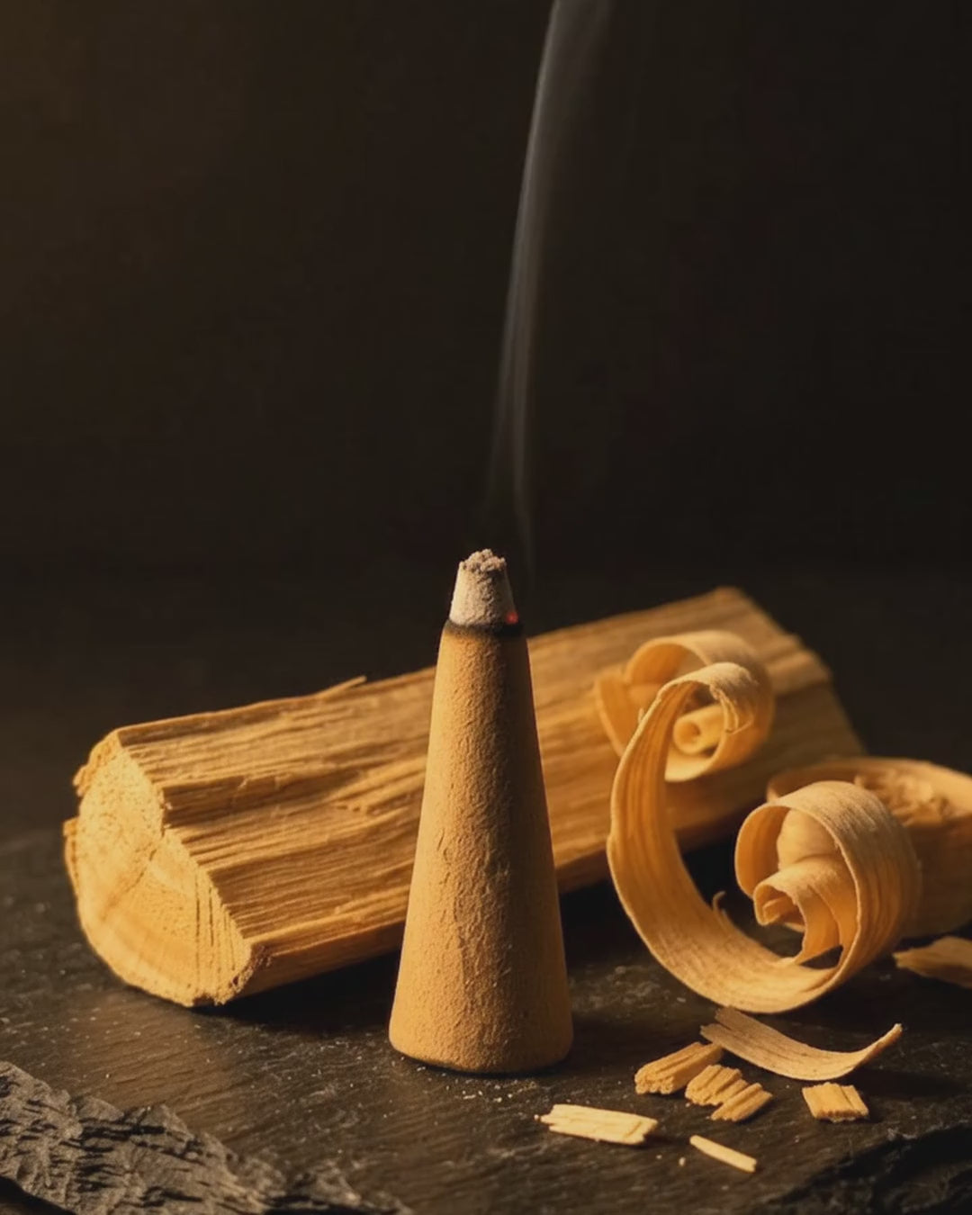 Smoke rising from a glowing Chandan Vritti dhoop cone (6 second loop, no sound)