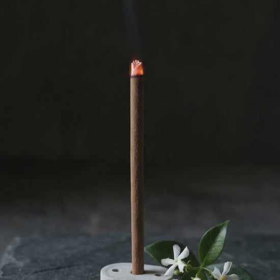 Smoke rising from a glowing Jasmine Lehar dhoop stick (6 second loop, no sound)