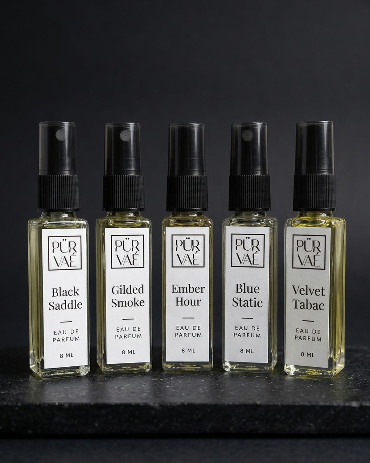 Root Five set: five Purvae eau de parfum 8 ml bottles on black stone