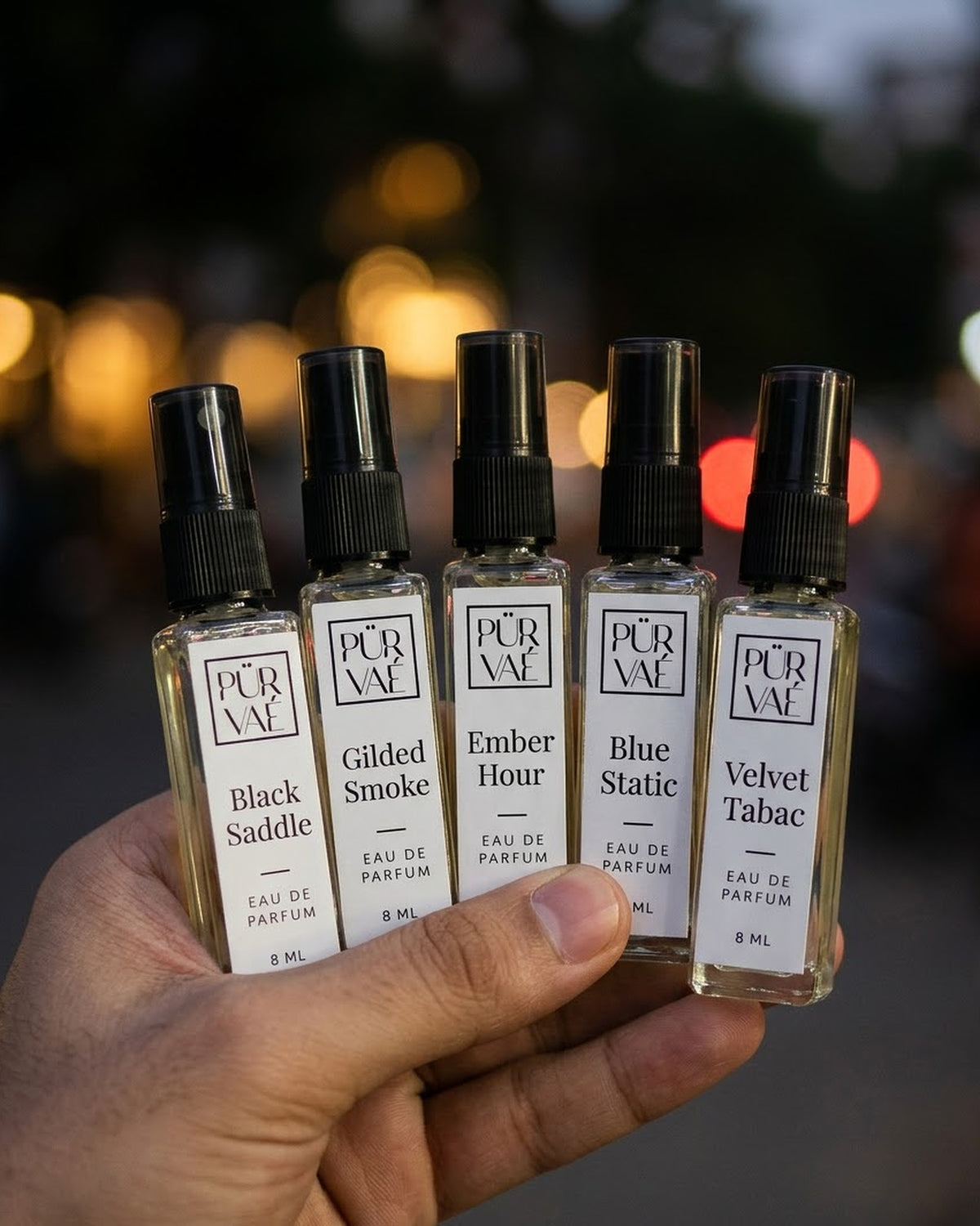 All five Root Five bottles fanned in one hand