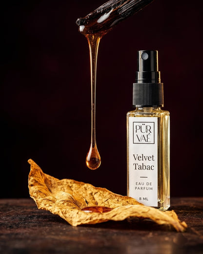 Vanilla syrup dripping onto a tobacco leaf beside Velvet Tabac