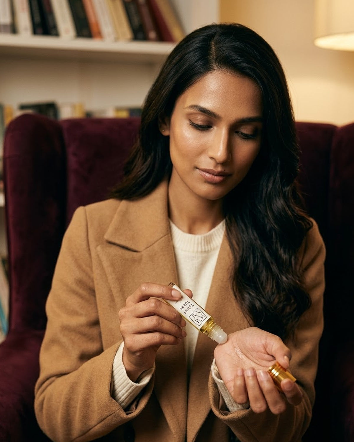 Velvet Tabac parfum oil being rolled onto the skin